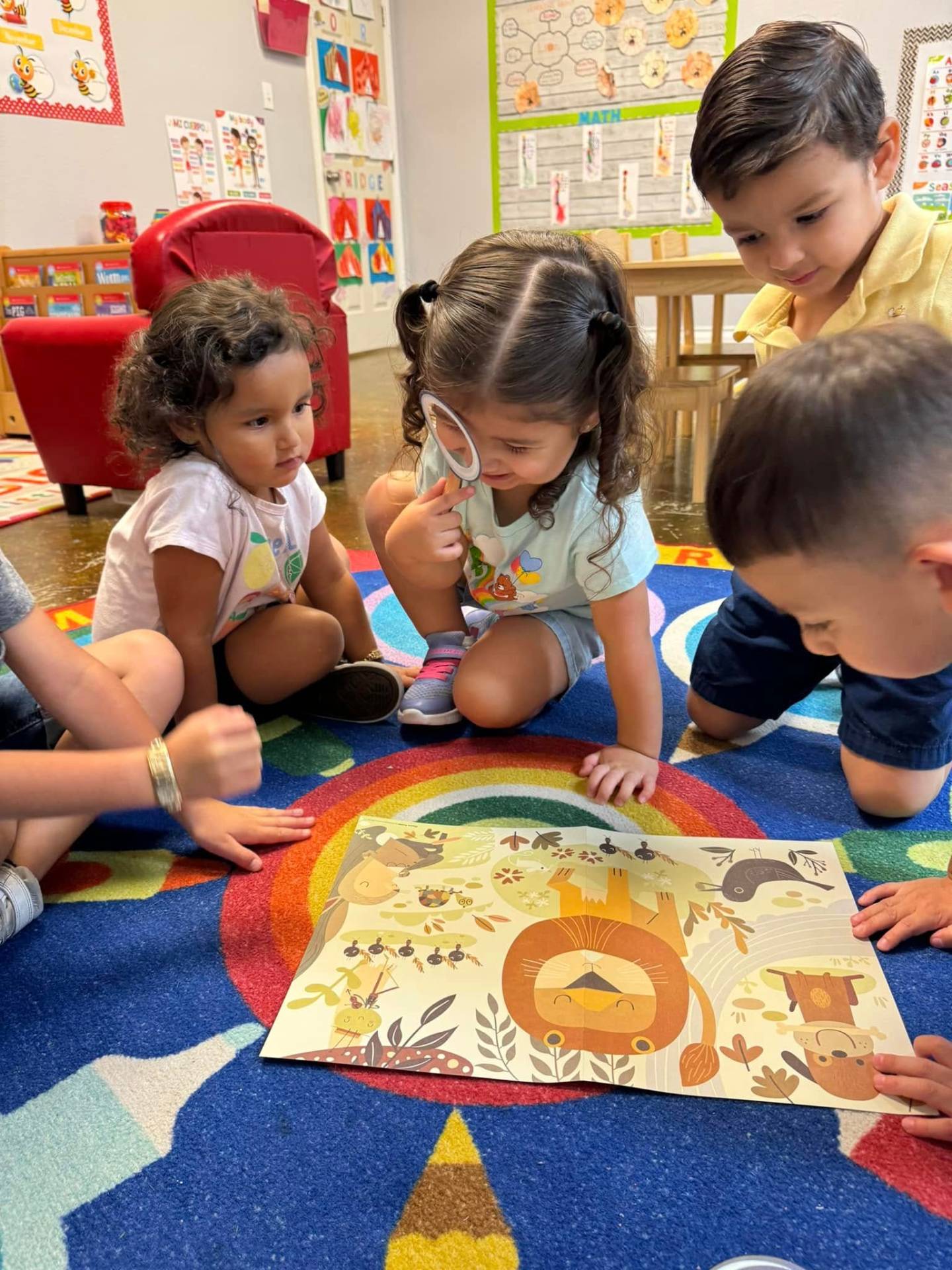 Teacher engaging with happy children